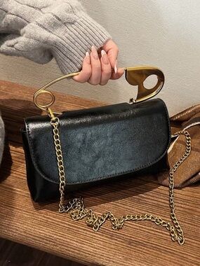 Macy's, Ladies BlackClutch with Gold Sculptural Handle Purse . NEW